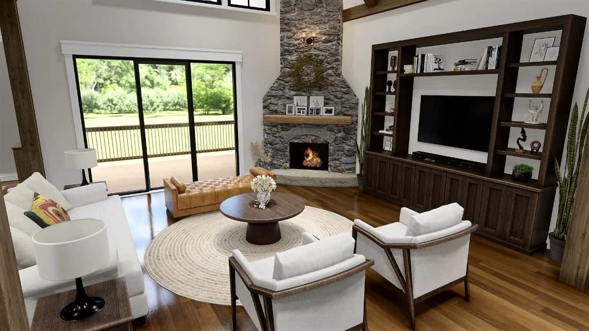 客厅里有一个角落壁炉，一个壁挂式电视，和一个圆形咖啡桌搭配的现代座椅。